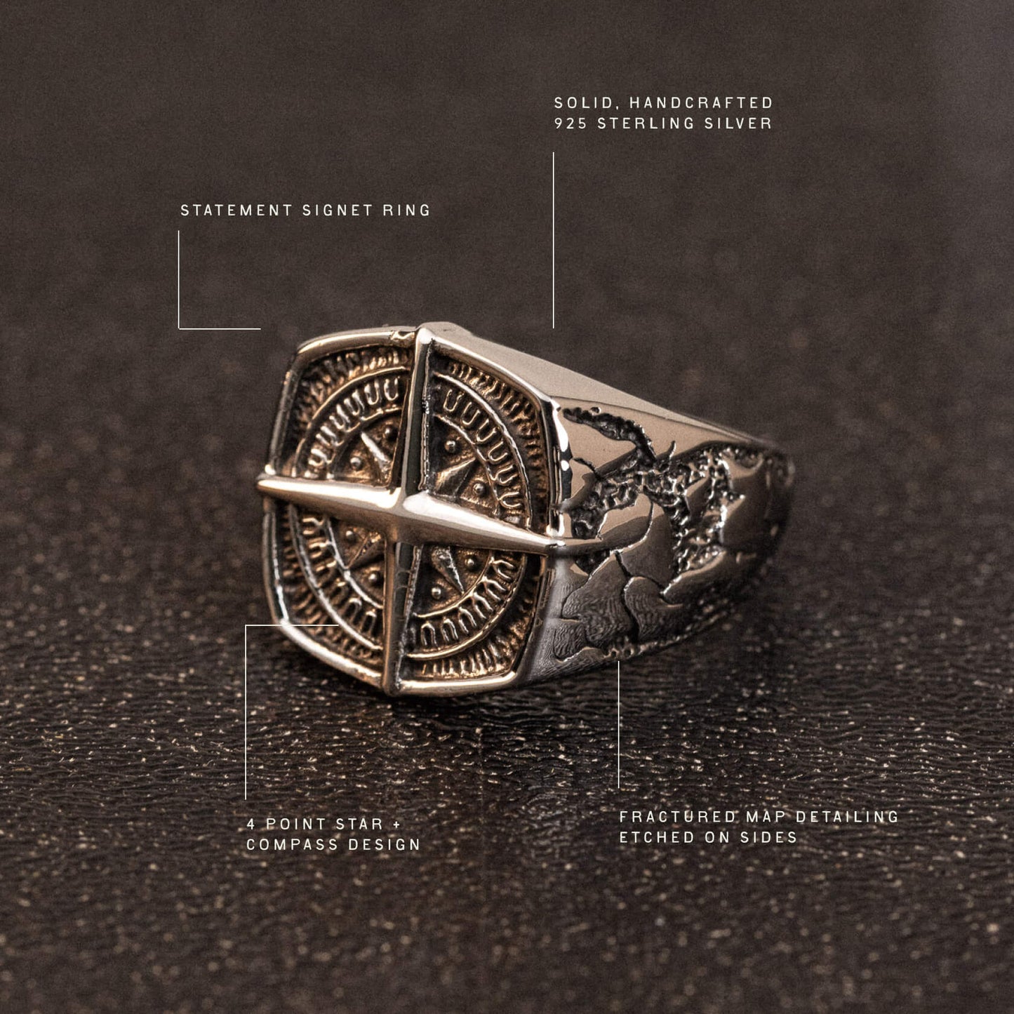 Sterling silver statement signet ring with compass star design and etched map detailing on sides.
