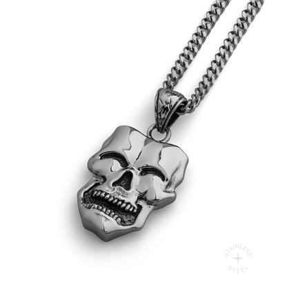 stainless steel pendant with double sided skull design inspired by comedy and tragedy masks