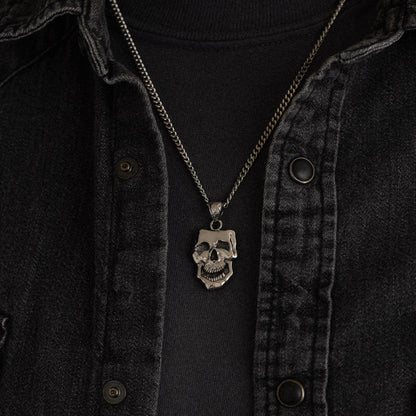 stainless steel pendant with double sided skull design inspired by comedy and tragedy masks