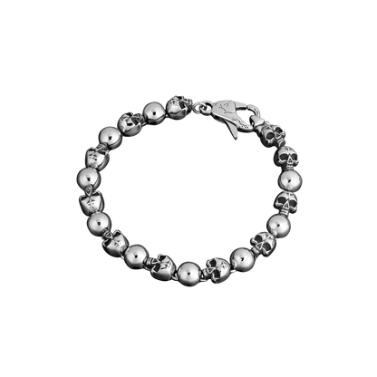 stainless steel bracelet with skull designs on a white background