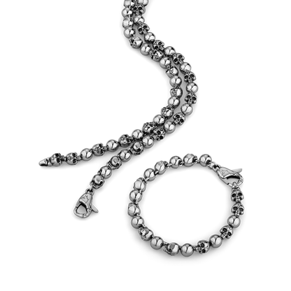 stainless steel beaded necklace and bracelet set on a white background