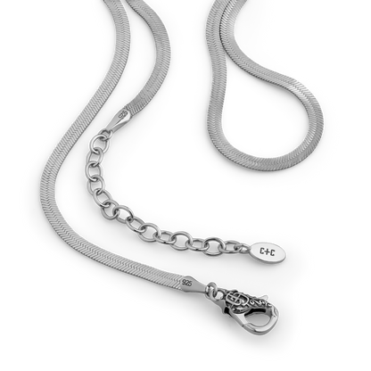 Silver herringbone chain necklace with lobster clasp and adjustable extension chain.