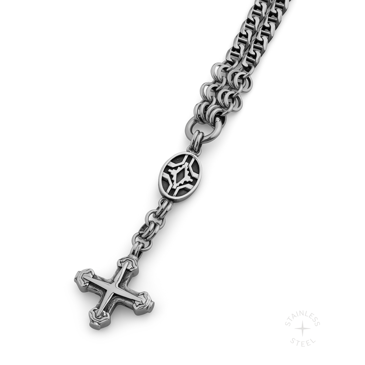 Silver-toned stainless steel chain necklace with decorative oval pendant and cross charm.