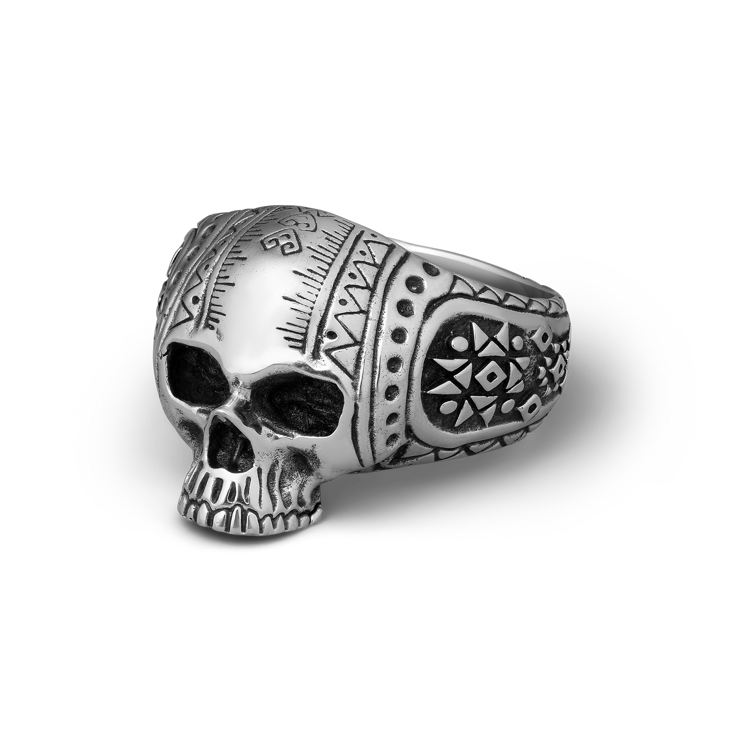 Silver skull ring with intricate patterns on a white background