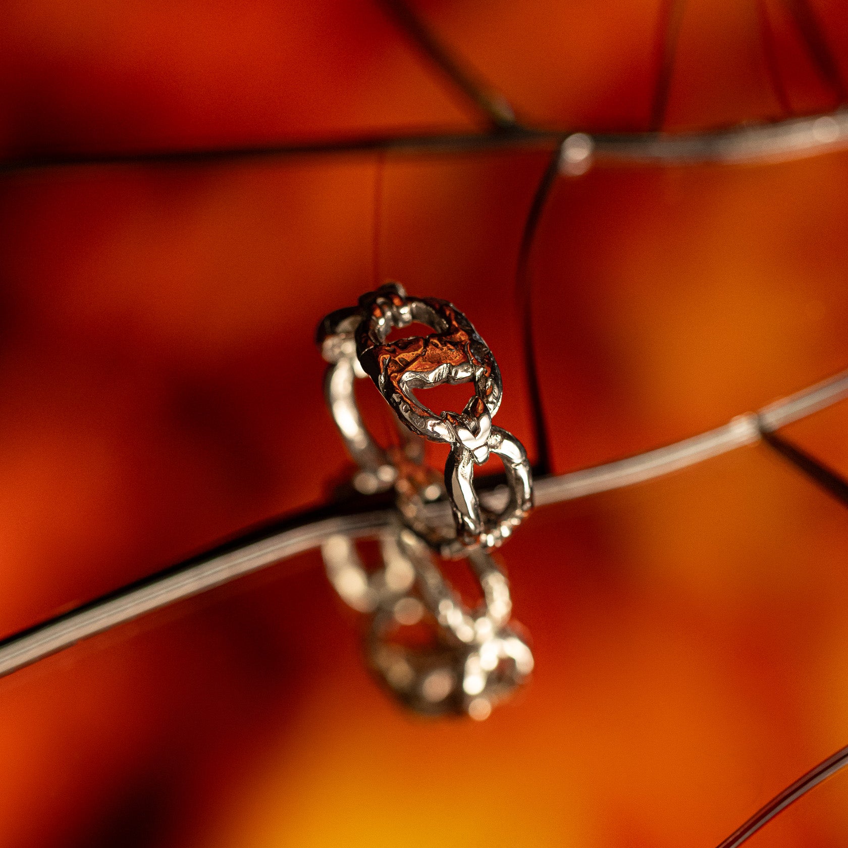 Iron bound sterling silver textured chain link band ring