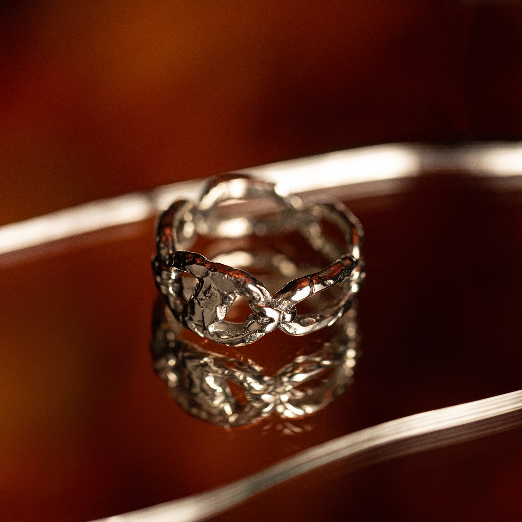 Iron bound sterling silver textured chain link band ring