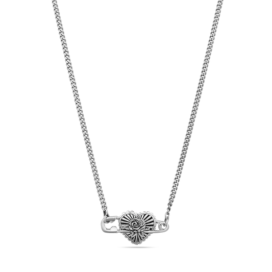 Silver-tone necklace with decorative heart-shaped pendant featuring spiral detailing on curb chain.