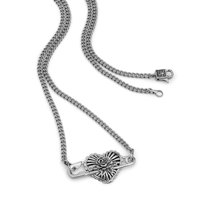 Silver-tone curb chain necklace with heart-shaped rose pendant and lobster clasp closure.