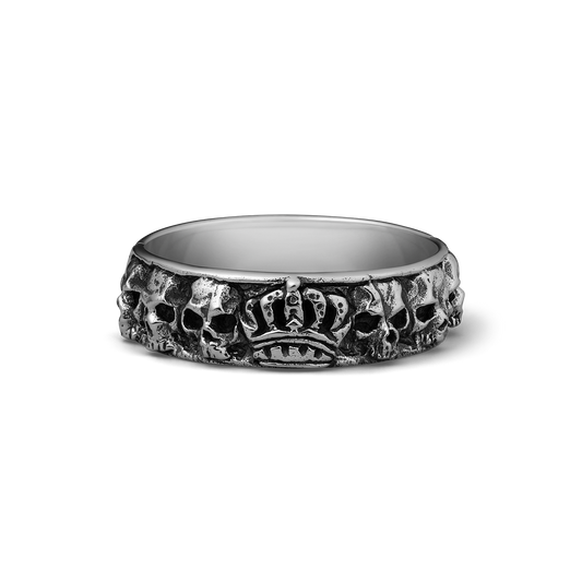 Silver band ring with skulls and crown motif around the exterior surface.