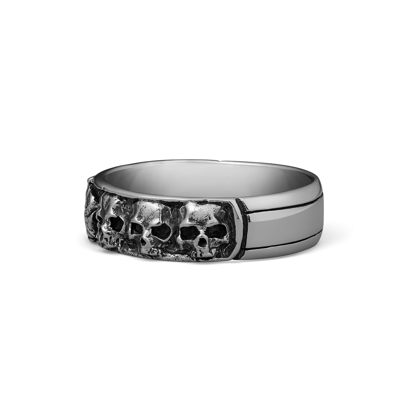 Silver-toned ring with multiple skull motifs on the front band and polished sides.